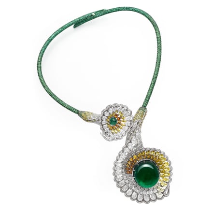Close-up of necklace set with emeralds, tsavorites, colored sapphires, yellow diamonds and diamonds