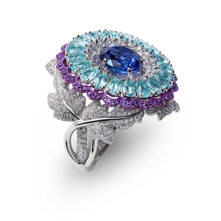 Close-up of a luxury ring set with tanzanites, Paraiba tourmalines, amethysts and diamonds