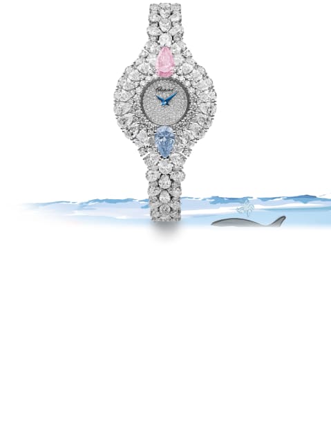 Eine faszinierende Damenuhr, besetzt mit einem rosafarbenen und blauen Diamanten, die von weißen Diamanten hervorgehoben werden.